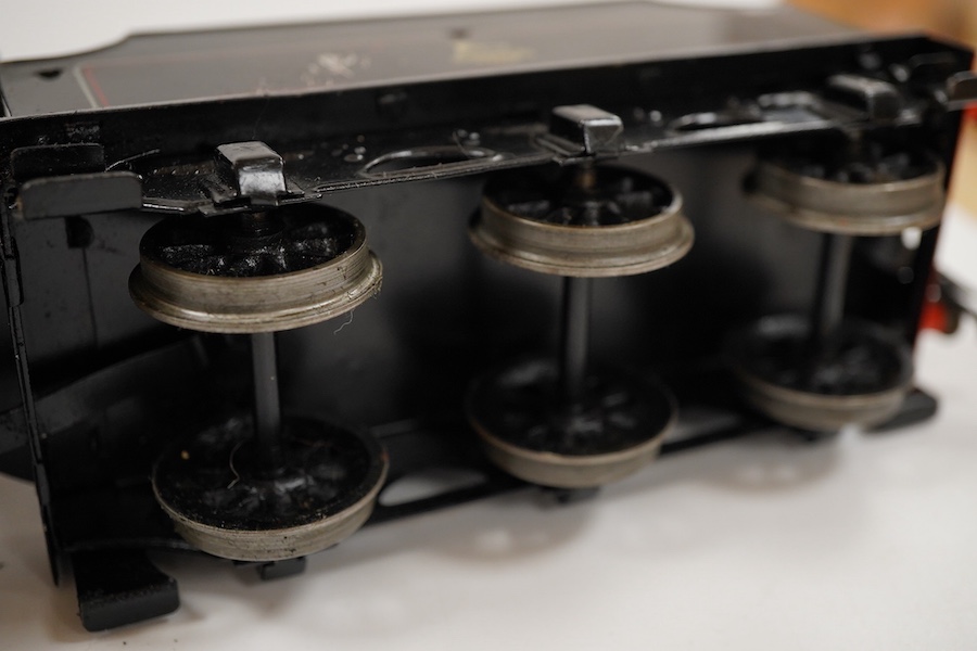 An 0 gauge Bassett-Lowke live steam spirit fired tinplate BR 2-6-0 Mogul tender locomotive, 42980, with original fuel tank and burner, two controls in the cab accessed through the cab roof